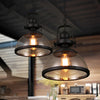 Industrial glass pendant light with black bowl-shaped glass shade and iron frame