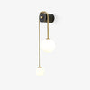 Brass arc wall sconce with two white glass shades for hallway and bedroom lighting