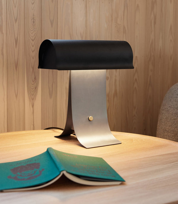 black paper table lamp with stainless steel for bedside reading nook