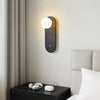 black travertine cylinder wall sconce white glass