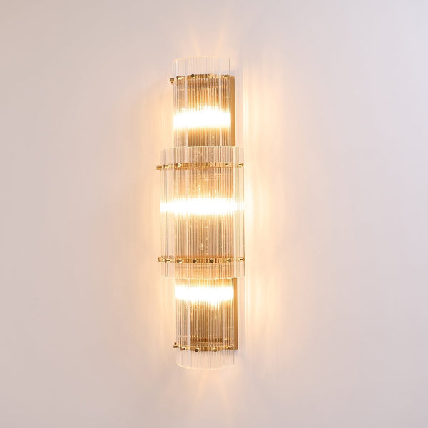 modern brass clear glass rod wall light