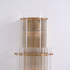 modern brass clear glass rod wall light