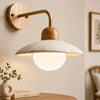 modern travertine disc wall sconce black gold