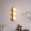 modern yellow travertine glass globe wall sconce