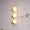 modern yellow travertine glass globe wall sconce