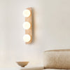 modern yellow travertine glass globe wall sconce