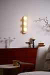 modern yellow travertine glass globe wall sconce