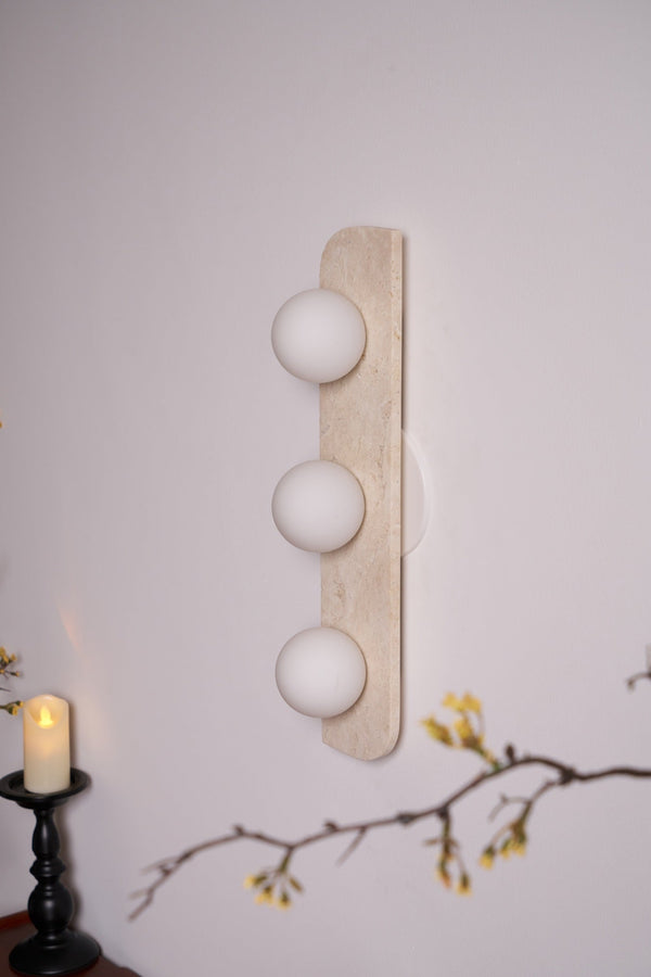 modern yellow travertine glass globe wall sconce