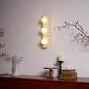 modern yellow travertine glass globe wall sconce