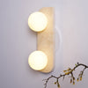 modern yellow travertine glass globe wall sconce