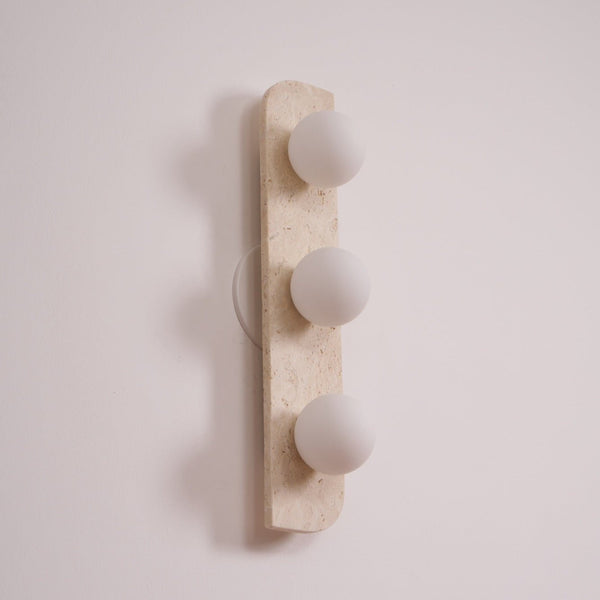 modern yellow travertine glass globe wall sconce