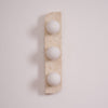 modern yellow travertine glass globe wall sconce