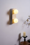 modern yellow travertine glass globe wall sconce