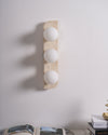 modern yellow travertine glass globe wall sconce