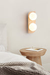 modern yellow travertine glass globe wall sconce