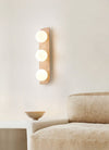 modern yellow travertine glass globe wall sconce