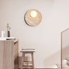 modern yellow travertine glass orb wall sconce