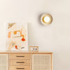 modern yellow travertine lunar eclipse wall sconce