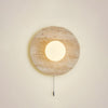 modern yellow travertine lunar eclipse wall sconce