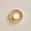 modern yellow travertine lunar eclipse wall sconce
