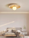 modern yellow travertine lunar eclipse wall sconce