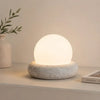 neutral travertine glass globe led table lamp