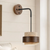 wabi sabi travertine cylinder wall sconce matte black