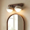 wabi sabi travertine walnut globe wall sconce
