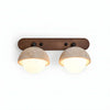 wabi sabi travertine walnut globe wall sconce