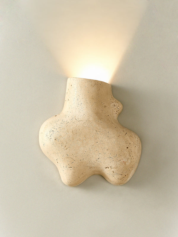 yellow travertine abstract wall sconce