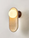 yellow travertine arch glass globe wall sconce