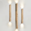 yellow travertine column wall sconce with dark walnut wood