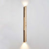 yellow travertine column wall sconce with dark walnut wood