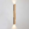 yellow travertine column wall sconce with dark walnut wood