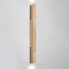 yellow travertine column wall sconce with dark walnut wood