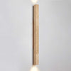 yellow travertine column wall sconce with dark walnut wood
