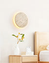 yellow travertine disc led wall sconce