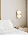 yellow travertine double globe wall sconce