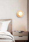 yellow travertine glass sphere wall sconce