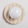 yellow travertine glass sphere wall sconce