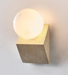 yellow travertine opal glass orb wall sconce