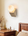 yellow travertine opal glass orb wall sconce