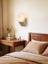 yellow travertine opal glass orb wall sconce