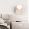 yellow travertine opaline glass globe wall sconce