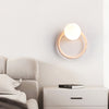 yellow travertine opaline glass globe wall sconce