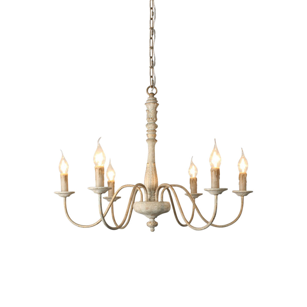 6-light French country chandelier with hand-carved wood and iron in a dining room