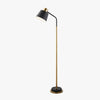 Gold mid-century modern floor lamp with adjustable shade in a contemporary living room