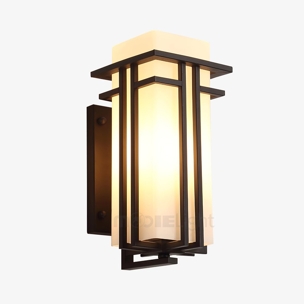 Black iron and white glass outdoor wall light mounted beside an entryway