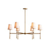 Round chandelier with tapered torch arms and linen shades