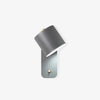 Rotatable cylinder wall sconce in modern metal finish mounted on a wall